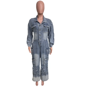 Detail of vintage washed denim jumpsuit with utility pockets and button-up front closure