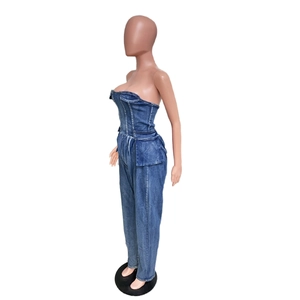 Detail view of denim strapless jumpsuit showing chest seam and large cargo pockets