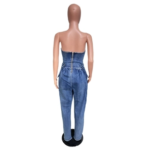 Back view of slim fit strapless denim jumpsuit with metal zipper and cinched waist detail