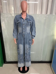 Detail of light blue washed denim jumpsuit featuring multi-pocket cargo design and long sleeves