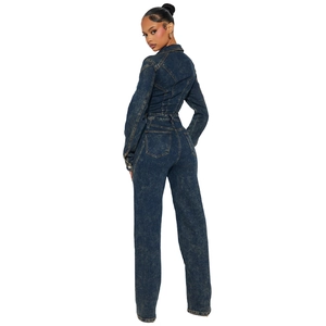 Deep blue washed denim jumpsuit with long sleeves and back pockets for a relaxed fit