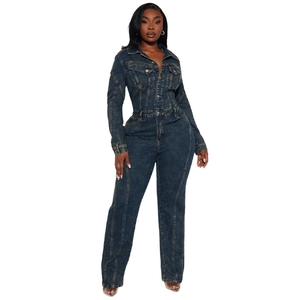 Detail of denim jumpsuit showing lapel collar, front buttons, and contrast stitching
