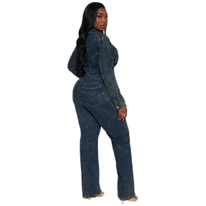 Detail of vintage washed denim jumpsuit featuring rear pockets and loose elastic fit