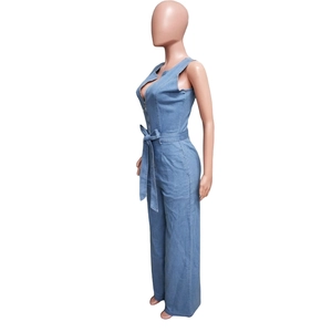 Detail view of denim sleeveless jumpsuit with metal zipper and adjustable belt