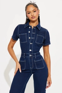 Detail of dark blue denim romper with white contrast stitching and utility pockets