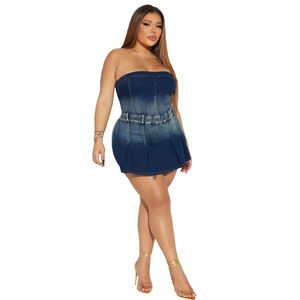 Detail of slim fit strapless denim mini dress with pleated hem and washed blue finish
