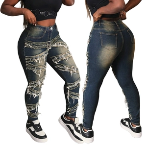 Jean skinny taille haute pour femmes en bleu foncé avec détails déchirés et frangés