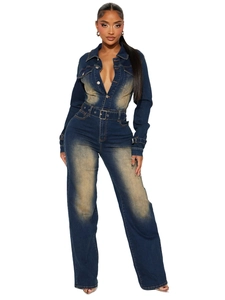 Slim fit dark blue denim jumpsuit with long sleeves, flare leg, and vintage wash finish