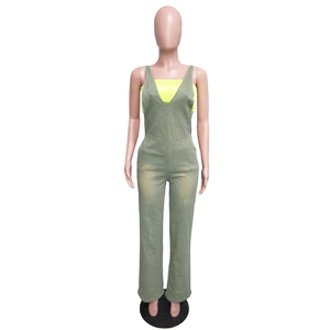 Detail showing the slim waist and wide-leg cut of the green denim jumpsuit on a mannequin