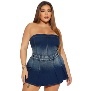 Detailed close-up of dark wash denim tube dress with slim-fit waist and pleated skirt