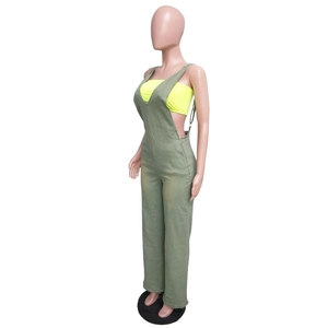 Side view of olive green slim fit denim jumpsuit with side button detailing for women