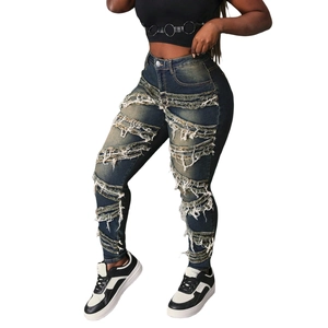 Jean skinny bleu foncé taille haute pour femme avec franges et détails déchirés