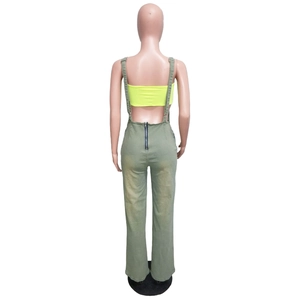 Rear view of slim denim jumpsuit featuring a metal zipper and military green fabric