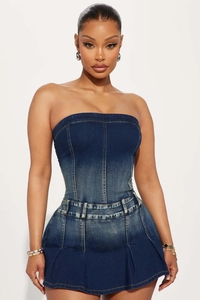 Detail shot of slim-fit dark blue gradient denim tube dress with white stitching