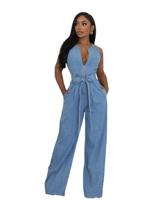 Women's light blue sleeveless denim jumpsuit with zip front and high waist tie belt