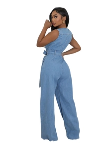 Slim fit sleeveless denim jumpsuit in washed blue with waist belt and wide leg style