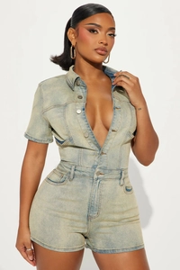Detailed close-up of light blue washed denim bodysuit with short sleeves and buttons