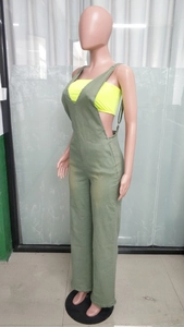 Detailed side view of high-waist wide-leg denim jumpsuit with deep V-neck and open side