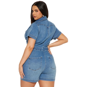 Detail view showing short sleeves and back pocket stitching on washed denim jumpsuit