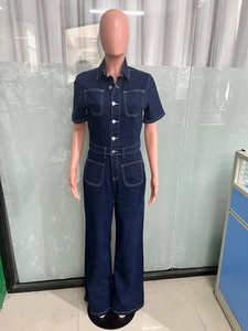 Detail showing contrast stitching on the dark blue denim jumpsuit pockets