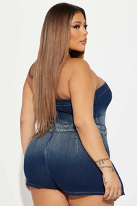 Detail of the high-stretch washed denim tube romper with a metal zipper on the back