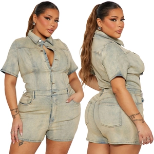 Detail view of washed light blue denim jumpsuit with lapel collar and single-breasted buttons