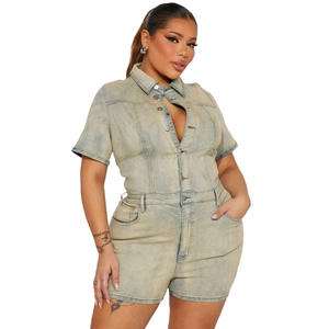 Front view detail of short sleeve denim jumpsuit with vintage wash and button closure