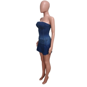 Detail view of the side stitching and belt loops on a slim-fit denim tube mini dress