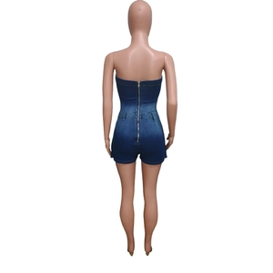 Detail of silver back zipper and slim waist on dark blue washed denim romper