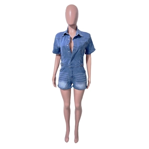 Close-up of blue washed denim playsuit with buttoned collar and elastic waist details