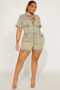 Front view of light blue washed denim romper with short sleeves and metal button closure