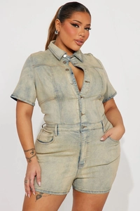 Close-up detail of light wash denim romper featuring metallic buttons and lapel collar