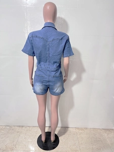 Back view of denim playsuit showing V-shaped stitching and symmetrical rear pockets