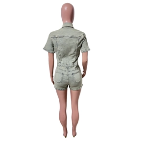 Detail view of the back of light green washed denim romper with pockets and stitching