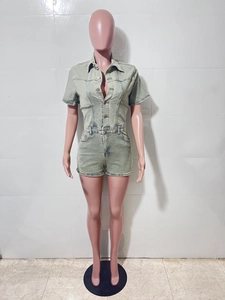 Detailed front view of light green wash denim short romper on a display mannequin
