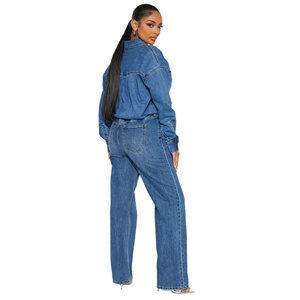 Rear view detail of mid-blue washed denim jumpsuit with wide-leg pants and long sleeves