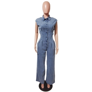 Detailed front view of light blue denim sleeveless jumpsuit with lapel collar and waist cinching