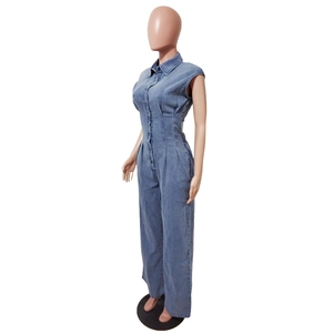Detail of waist cutout design and pleated slimming effect on denim jumpsuit