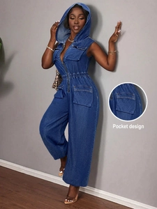 Detail of cargo pocket design on dark blue denim hooded sleeveless jumpsuit with wide legs