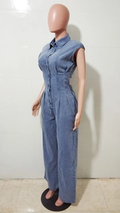 Close-up of sleeveless denim jumpsuit featuring a lapel collar and button-up front closure