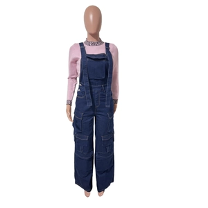 Detail of pink knit top with Greek key pattern and denim cargo overalls with pockets
