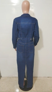 Detailed back view of long denim trench coat featuring waist metal buttons and high slit