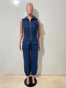 Detail of dark blue denim sleeveless jumpsuit with hood, front zipper and utility pockets