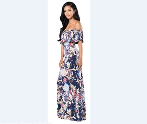 Detail of off-shoulder neckline with layered ruffles on floral bohemian maxi dress