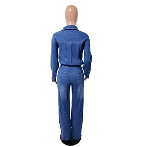 Rear view of long sleeve dark blue denim jumpsuit with back pockets and classic straight leg