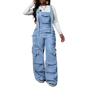 Macro view of light blue denim overalls featuring multi-pocket utility design and stitching