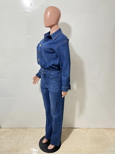 Detail of slim fit denim jumpsuit featuring button closure and washed texture effect