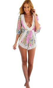 Floral print V-neck romper with white lace trim and colorful geometric patterns