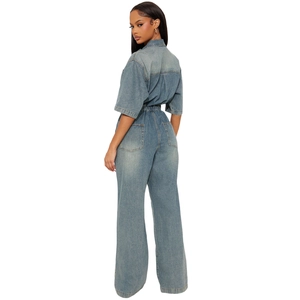 Slim fit light blue denim jumpsuit with elastic waist and flared wide leg pants
