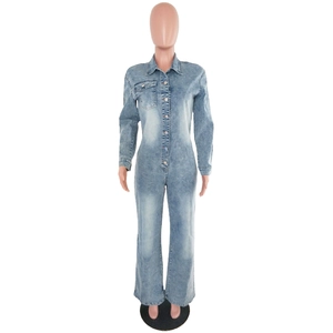 Close-up of washed blue denim jumpsuit showing lapel collar and metal button-up front